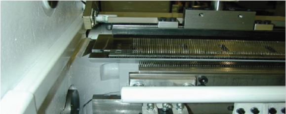 Tufting machine with CMC cutting attachment